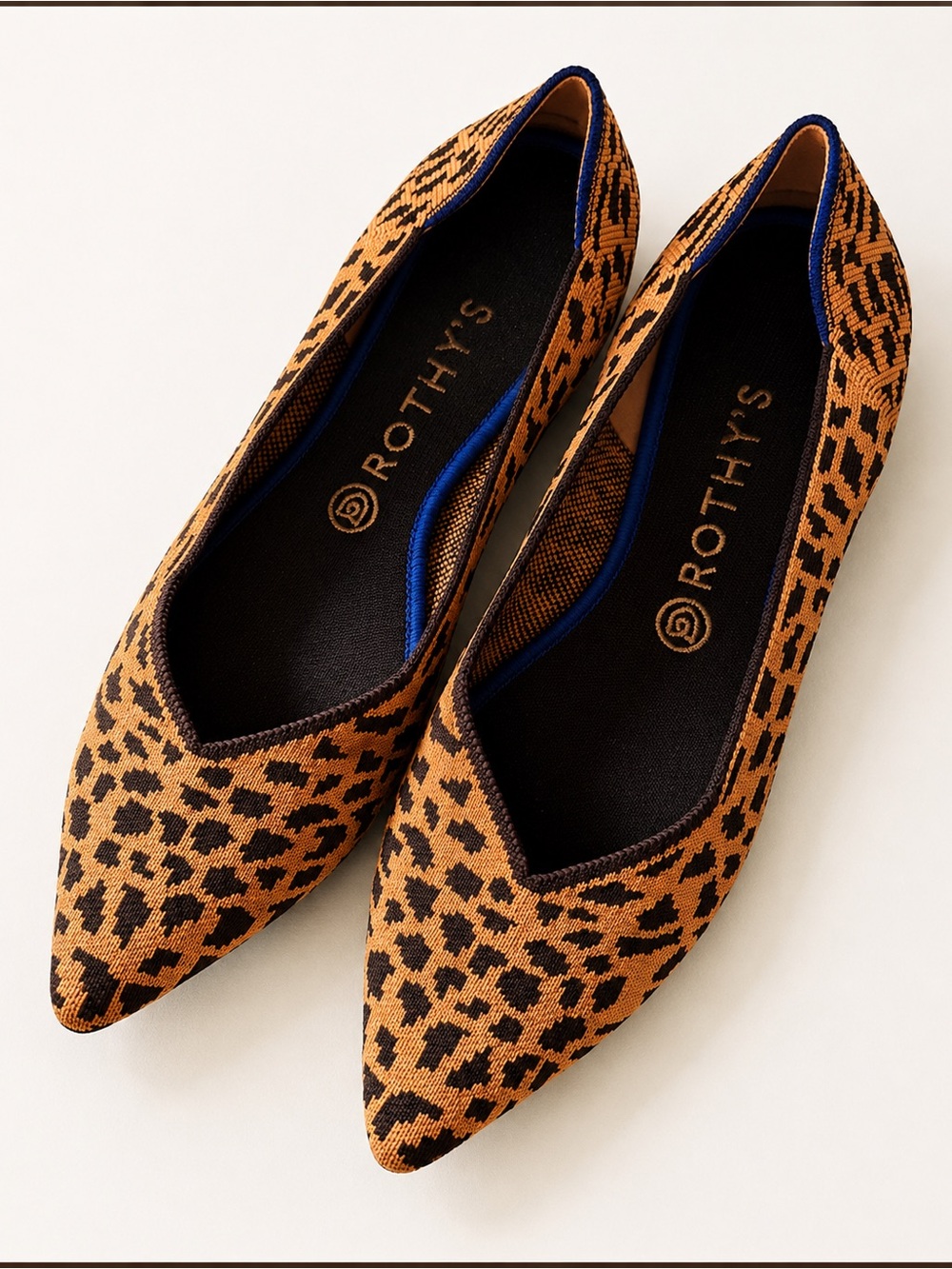Rothy’s pointed toe flats in a bold leopard print